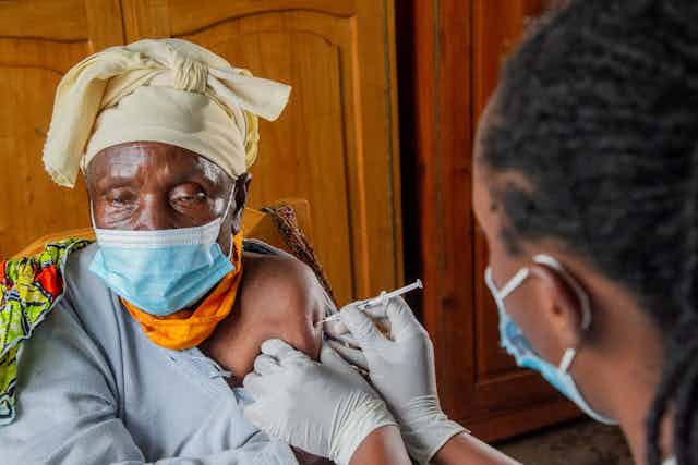 Elderly woman getting covid vaccine