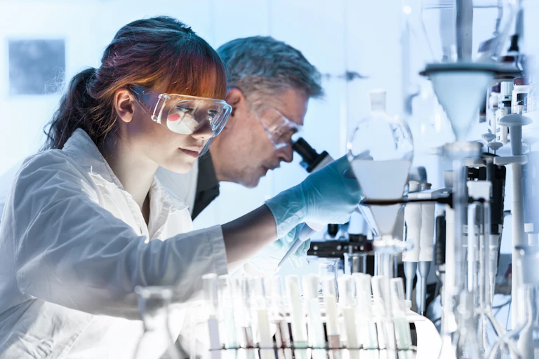Health care researchers working in life science laboratory