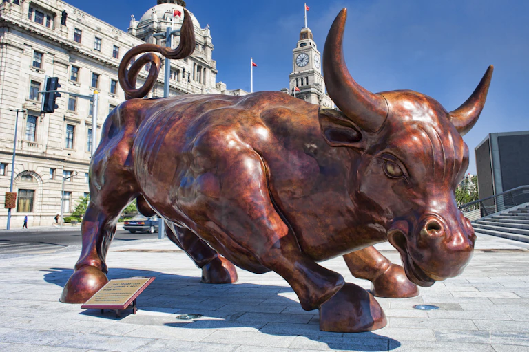 Bronze bull on July 22, 2010 in Shanghai, China. Bronze bull on Bund in Shanghai.