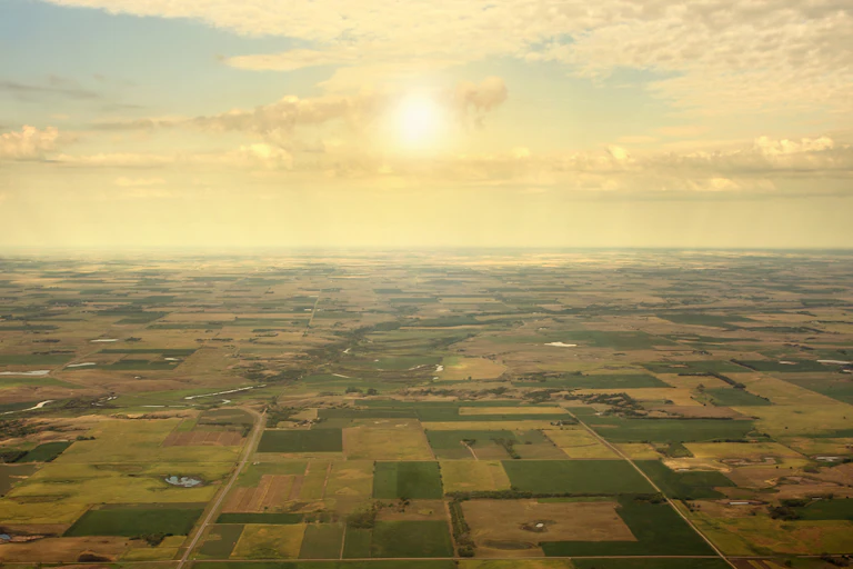 Aerial view of farmland at sunset