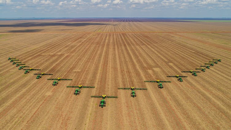Tractors in a large field