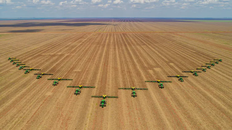 Tractors in a large field