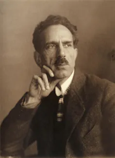 Sepia portrait of Paira Mall in suit, with strong dark moustache.