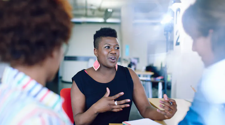 Black woman talking in work meeting