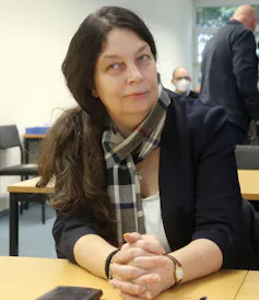 Birgit Malsack-Winkemann sitting at a table in court.