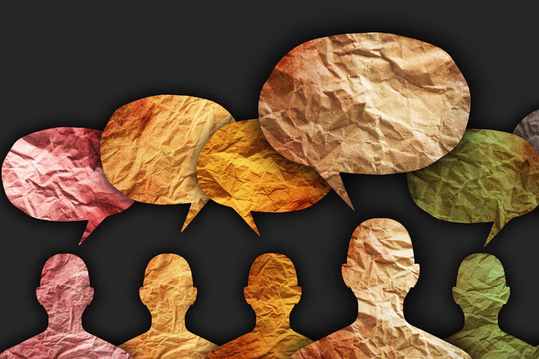 An image shows the silhouettes of people with speech