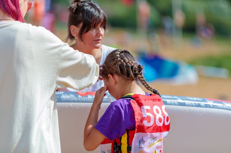 A girl cries at a sporting competition