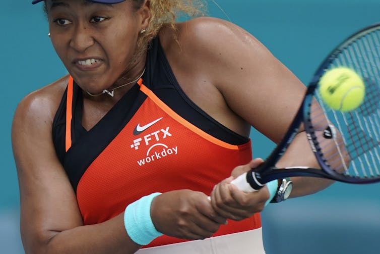 Tennis player Naomi Osaka advertises FTX while playing at the Miami Open tennis tournament in April 2022 in Florida.