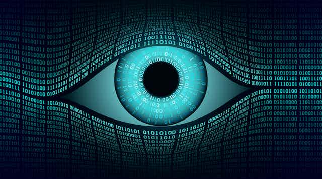 Illustration of a large eye made of binary code, signifying digital surveillance