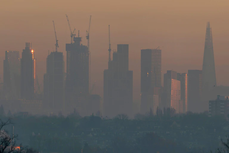 skyscraper skyline through haze