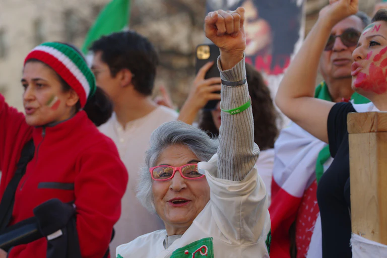 A woman with her fist in the air.