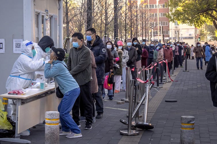 A line of people waiting to be swabbed for COVID-19.