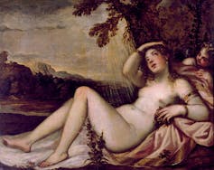 A painting shows a nude woman reclining on a bed with soft rain behind her.