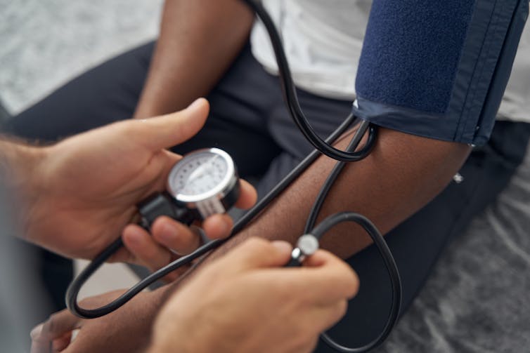 person getting blood pressure checked