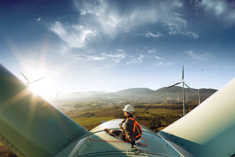 worker top of wind turbine