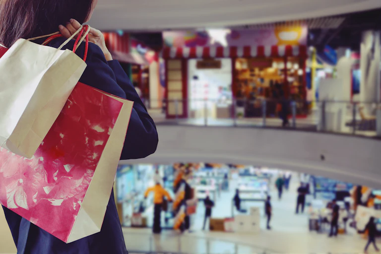 Woman holding shopping bags in the shopping mall