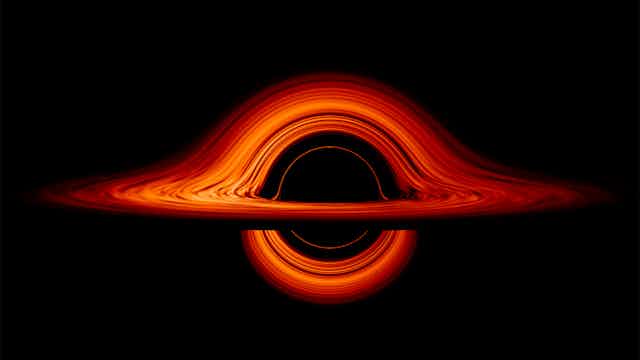 Illustration showed lines of orange light looping around a black hole.