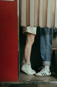 Teens legs in photo booth