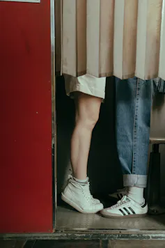 Teens legs in photo booth