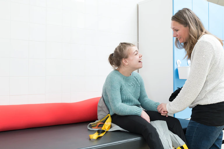 young person with disability and carer