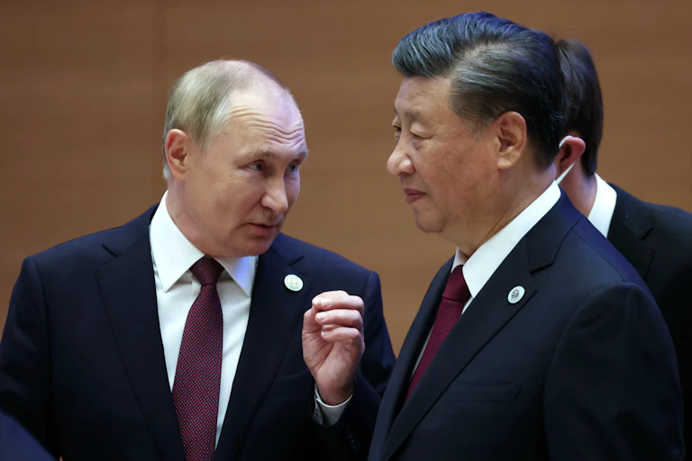 Russian president Vladimir Putin speaks with Chinese president Xi Jinping