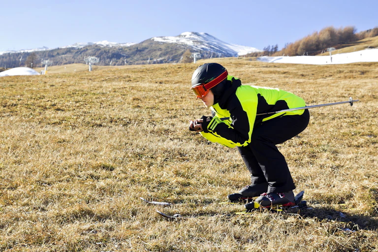Man skiing on grass