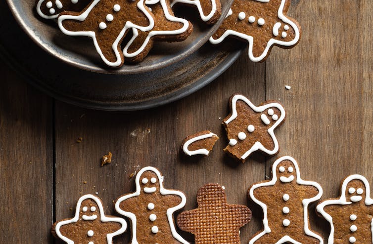 gingerbread men falling out of a bowl