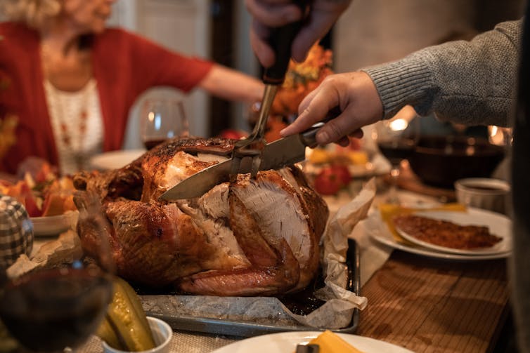 cutting turkey at the table