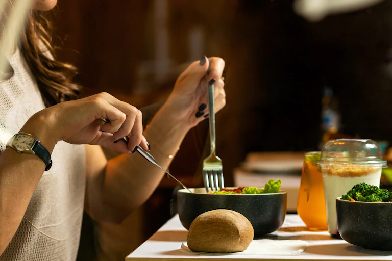 Person eating a salad
