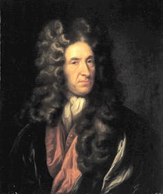 A portrait of Daniel Defoe wearing a large wig and red shirt.