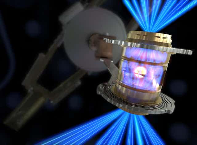 Laser energy being converted into X-rays inside a box, which compress a fuel capsule until it implodes.