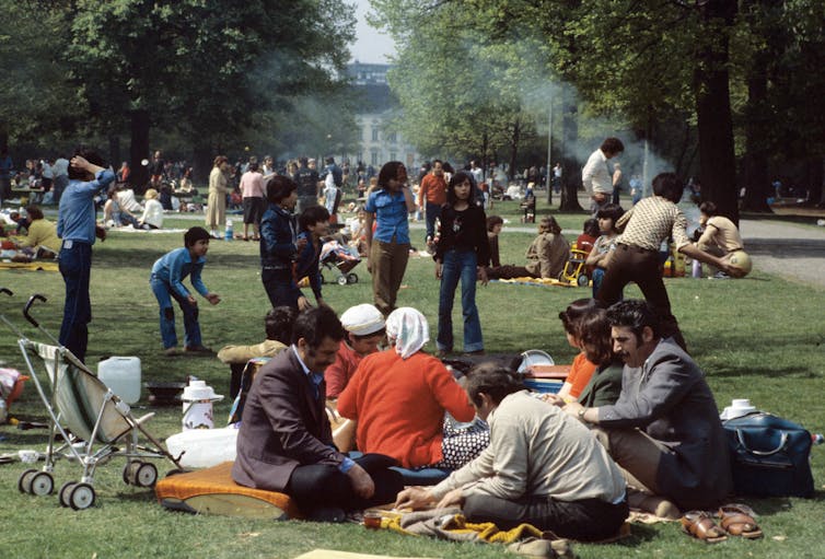 Families playing in a park.