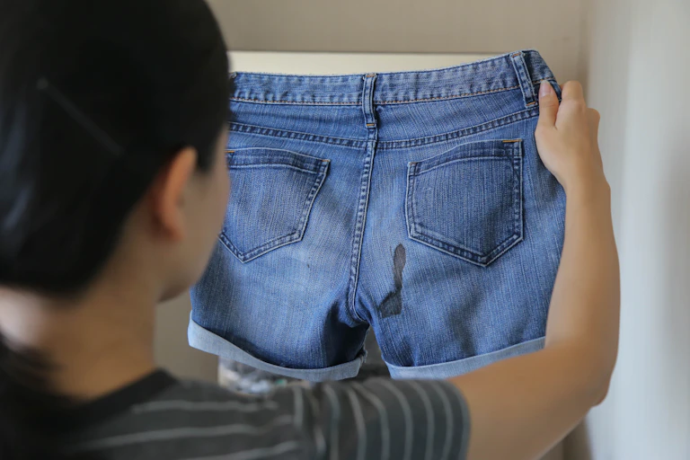 Blood stain on the back of denim shorts
