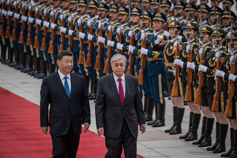 Kazakhstan president Kassym-Jomart Tokayev inspects Chinese troops with China's president Xi Jinping, Beijing, September 2019.
