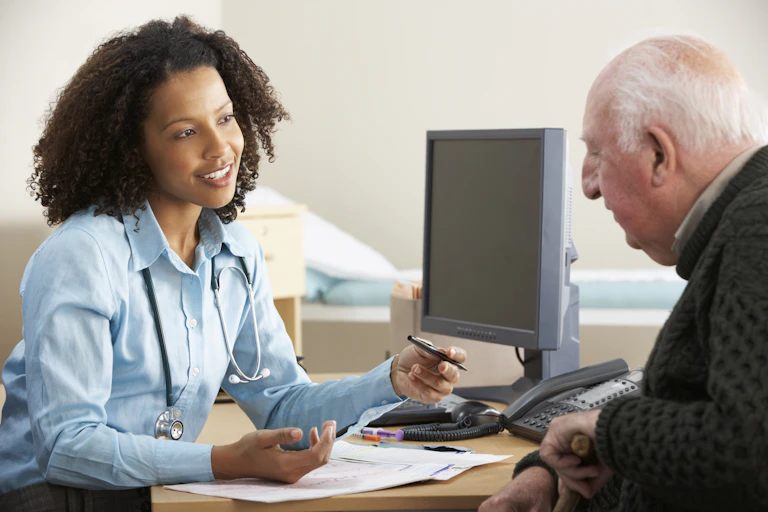 Female doctor talking to patient
