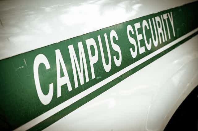 A police squard car is emblazoned with the words "Campus Security."