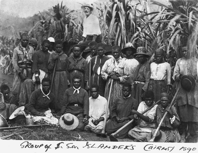 Photo from 1890, a group of Islander farm workers. 62,000 South Sea Islanders were shipped to Australia to work on plantations. State Library of Queensland
