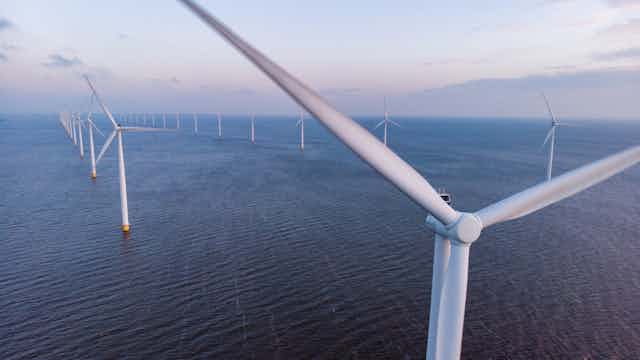 aerial shot of offshore wind turbines