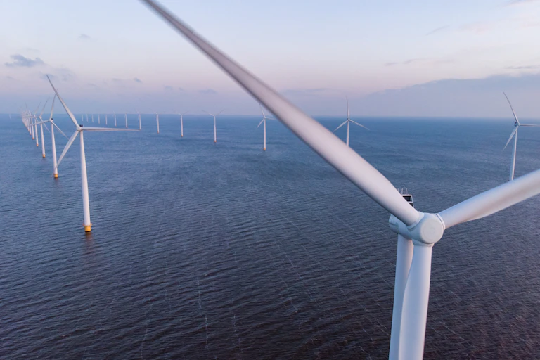 aerial shot of offshore wind turbines