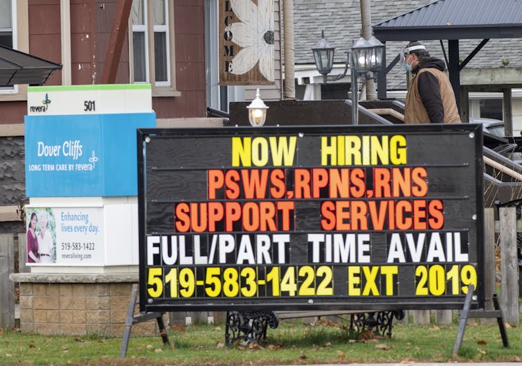 A sign reading'Now hiring PSWs RPNs RNs support services full/part time avail'