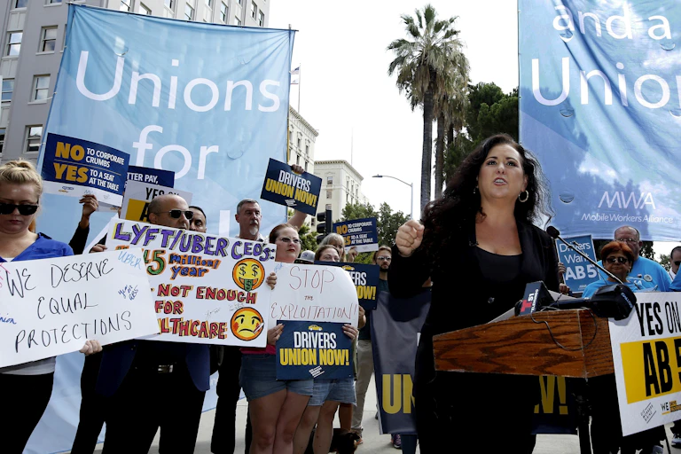 Uber and Lyft drivers at a protest