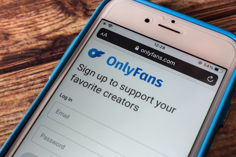 A phone showing the log on screen for the website OnlyFans.