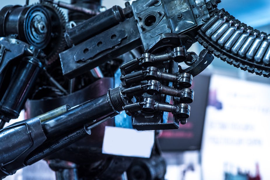 Automatic robot hand holds a machine gun