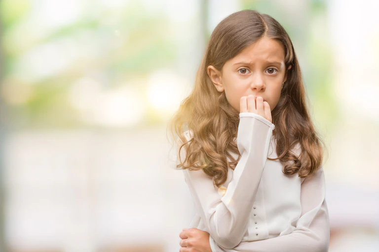 Worried girl with light brown hair