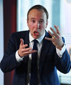 Matt Hancock pulling a bizarre expression as he gesticulates during a speech.