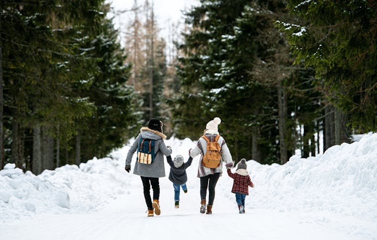 A family walking in the snow