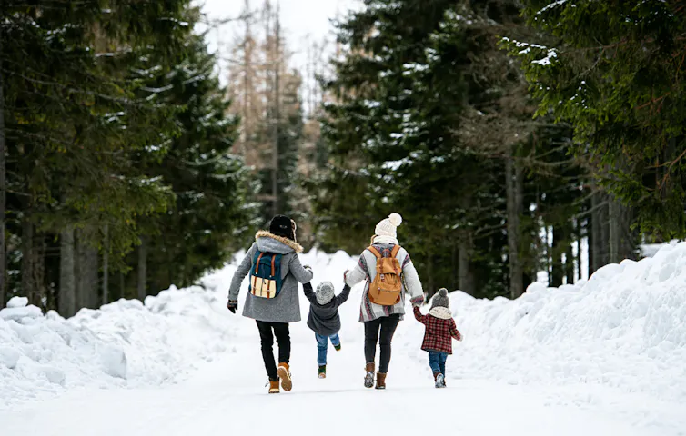 A family walking in the snow
