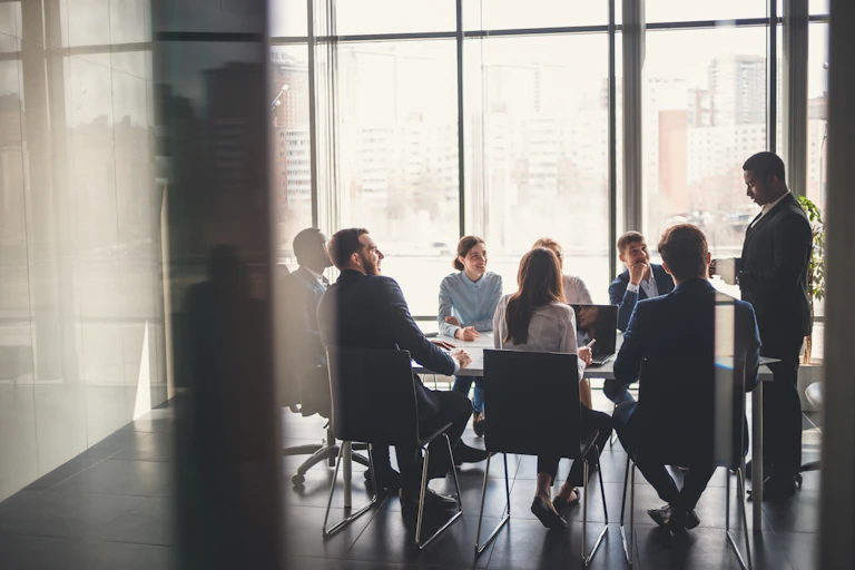 A group of people having a meeting in a conference room