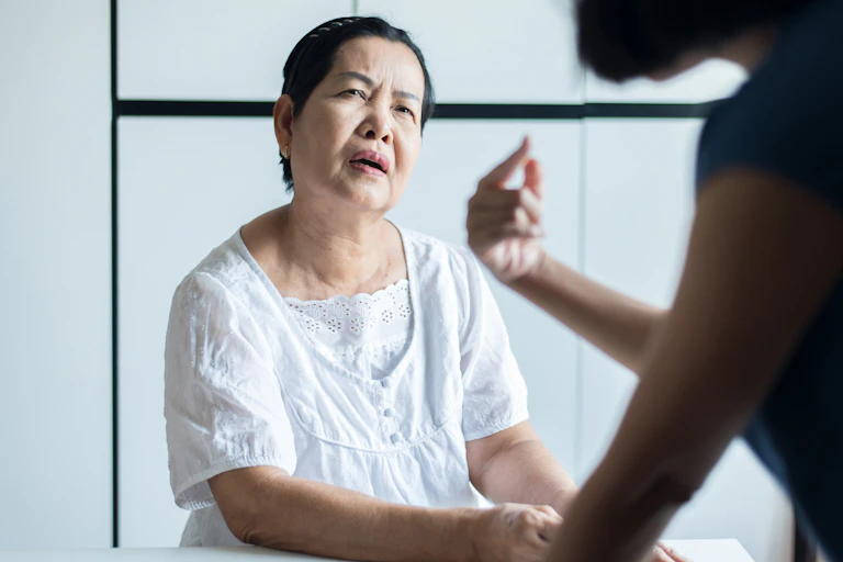 Older woman looks confused