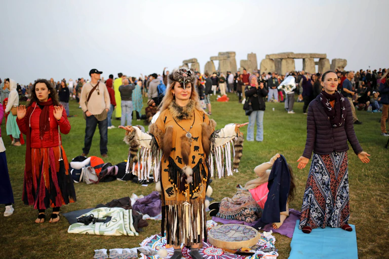 People standing at Stonehenge.
